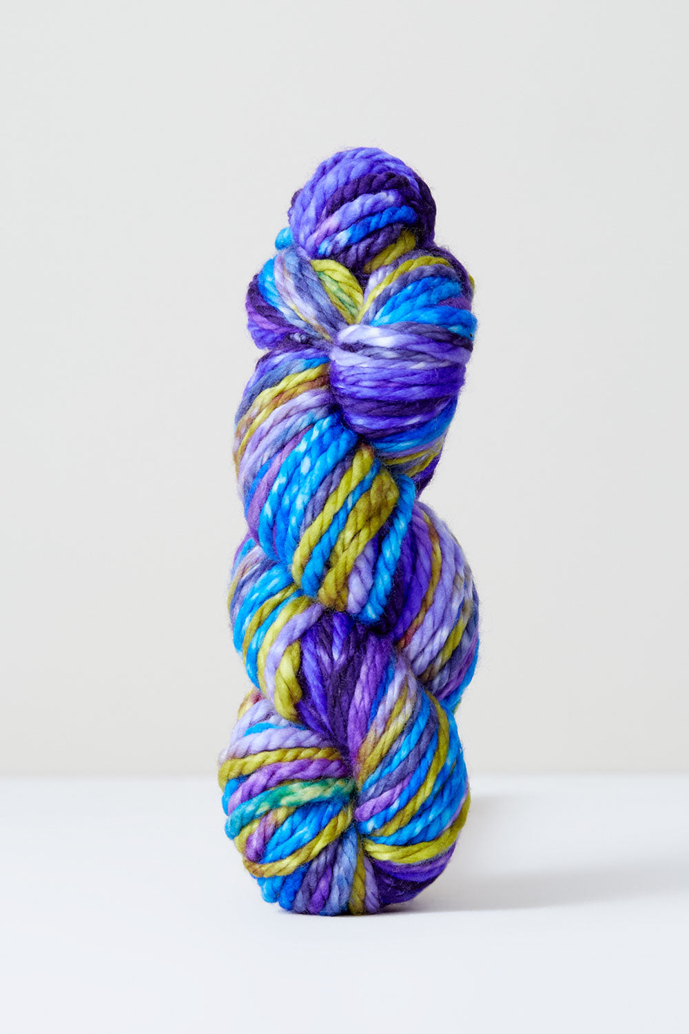 Purple and white variegated OmegaCrys baby weight yarn, 1.4 ounce ball